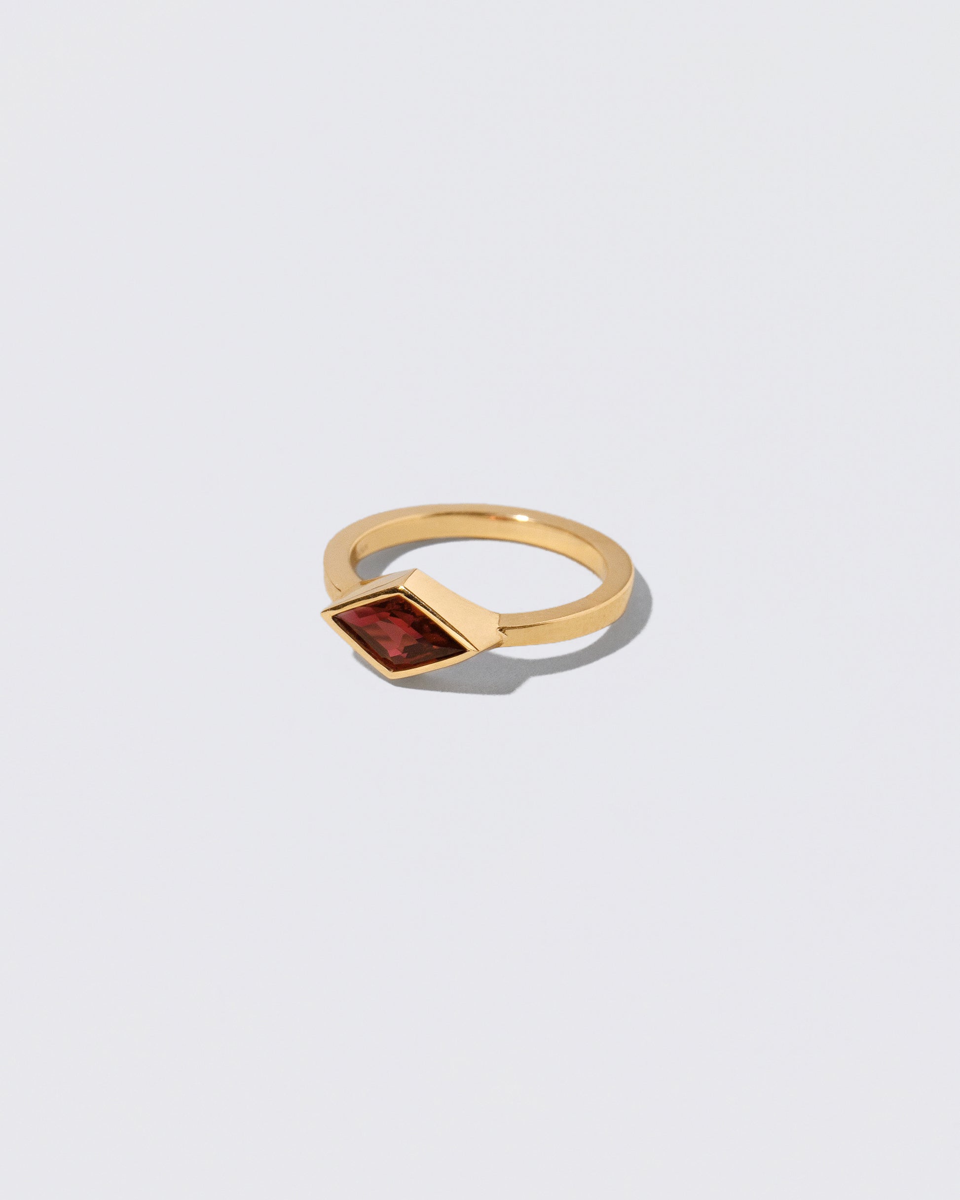 View from the side of the Warmhearted Ring on light color background.