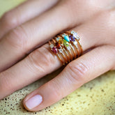 product_details::Pink Tourmaline, Red Garnet, Citrine, Peridot, Turquoise, Amethyst and Blue Moonstone Teardrops Rings on model.