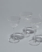 Closeup details of the Sophie Lou Jacobsen Cosmo Cordial Coupe Glass Set on light color background.