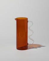 Sophie Lou Jacobsen Amber with Clear Handle Wave Pitcher on light color background.