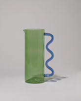 Sophie Lou Jacobsen Green with Blue Handle Wave Pitcher on light color background.