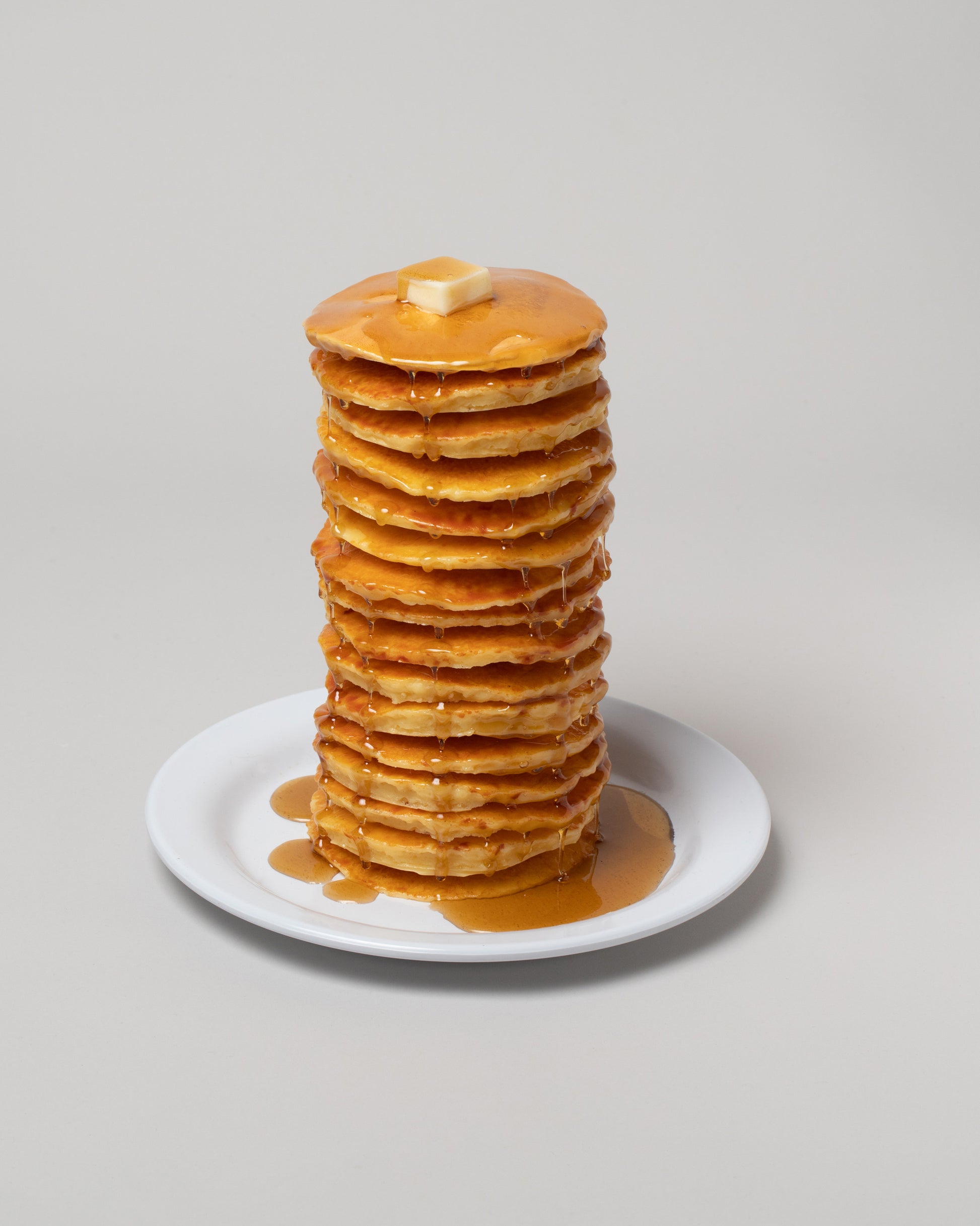 Closeup detail of the Spills Tall Stack Pancakes & Waffles on light color background.