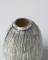 Closeup detail of the Suzanne Sullivan Egg Shaped Vase on light color background.