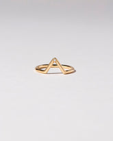 Gold White Diamond Single Burnish-Set Stone Triangle Band on light color background.