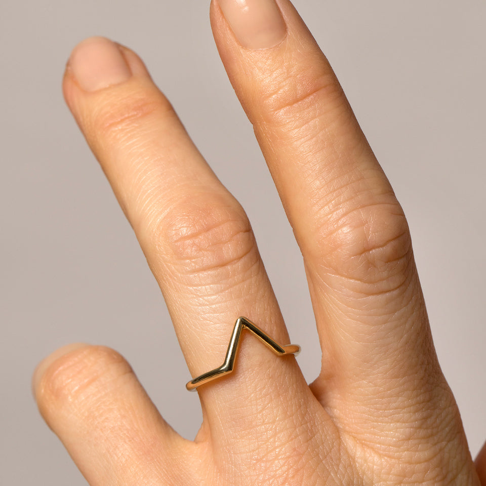 product_details::Round Yellow Gold Triangle Band on model.