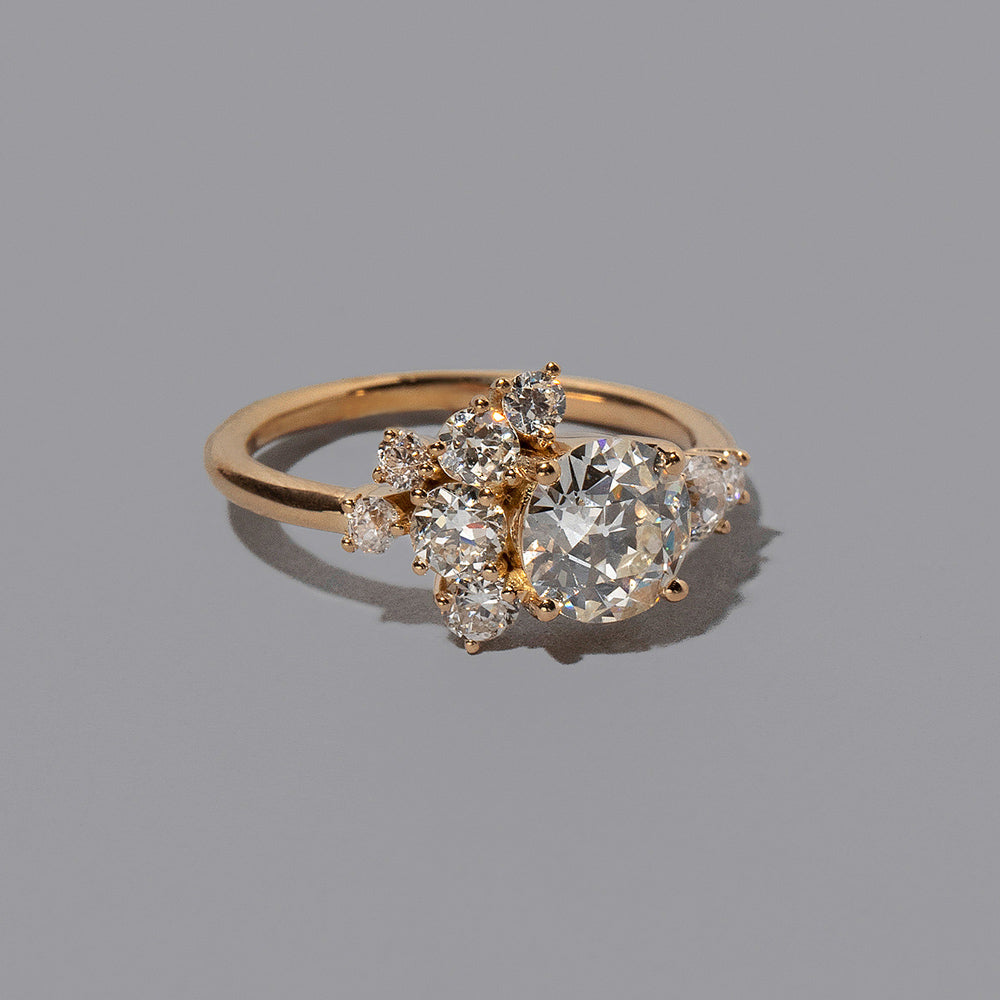 product_details::Closeup details of the Mega White Diamond Vega Ring on light color background.