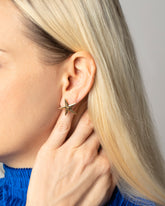 Editorial photo of model wearing the Verve Five Point Stud Earrings - Large.