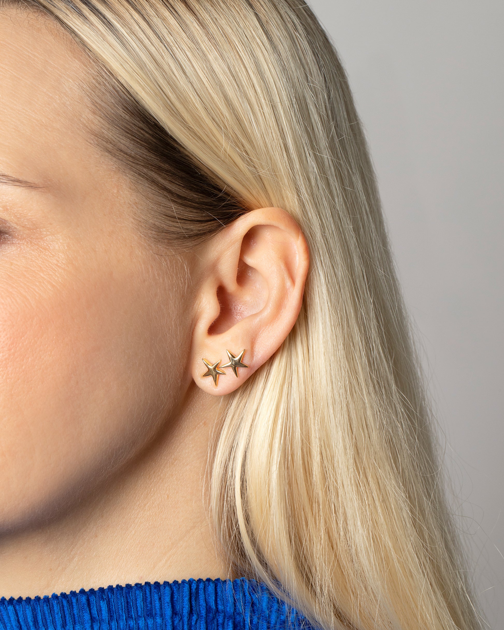 Editorial photo of model wearing the Verve Five Point Star Stud Earrings - Small.