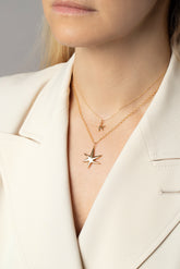 Editorial photo of model wearing the Verve Six Point Star Charms.
