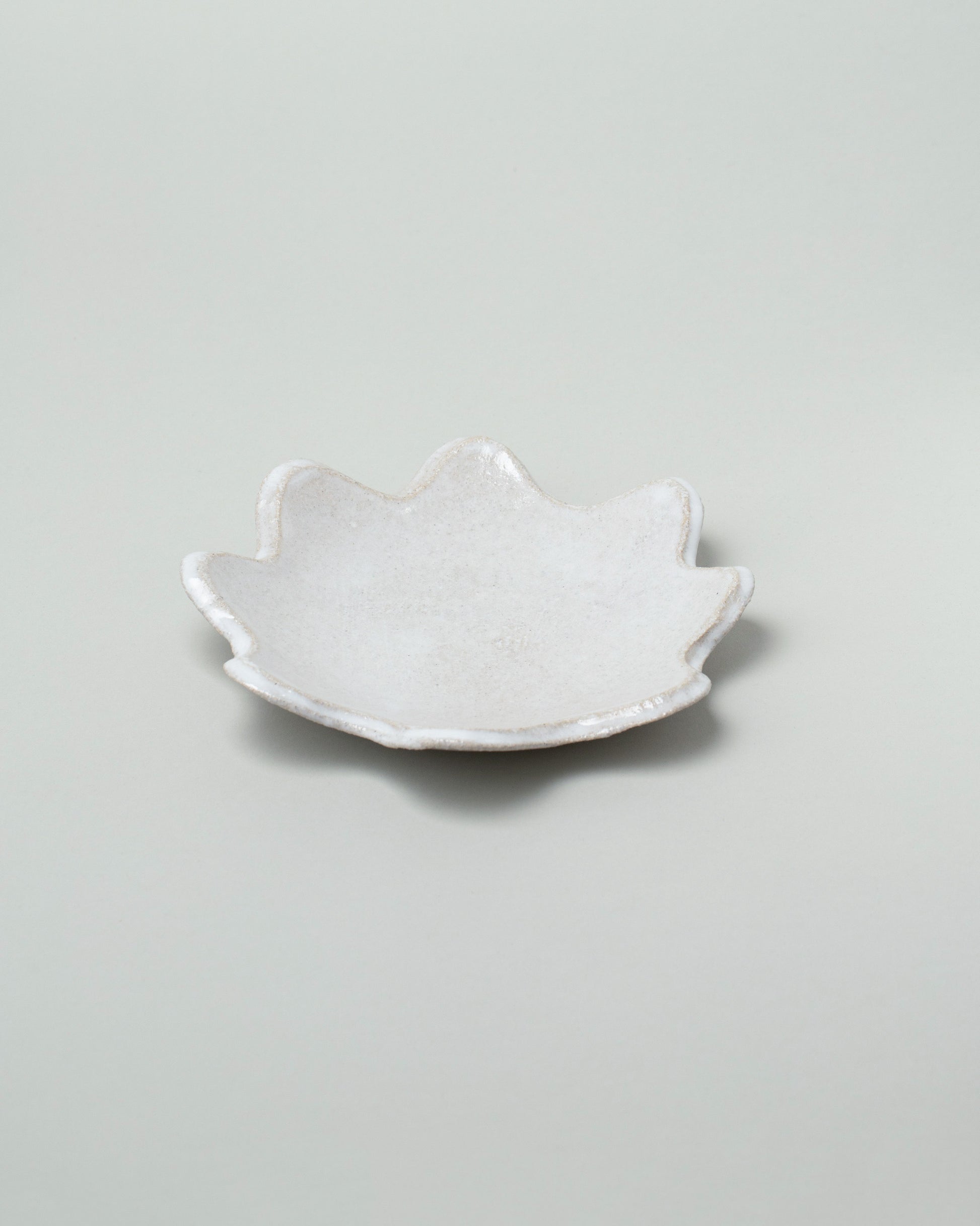 Morgan Peck Pearl Small Scallop Platter on light color background.