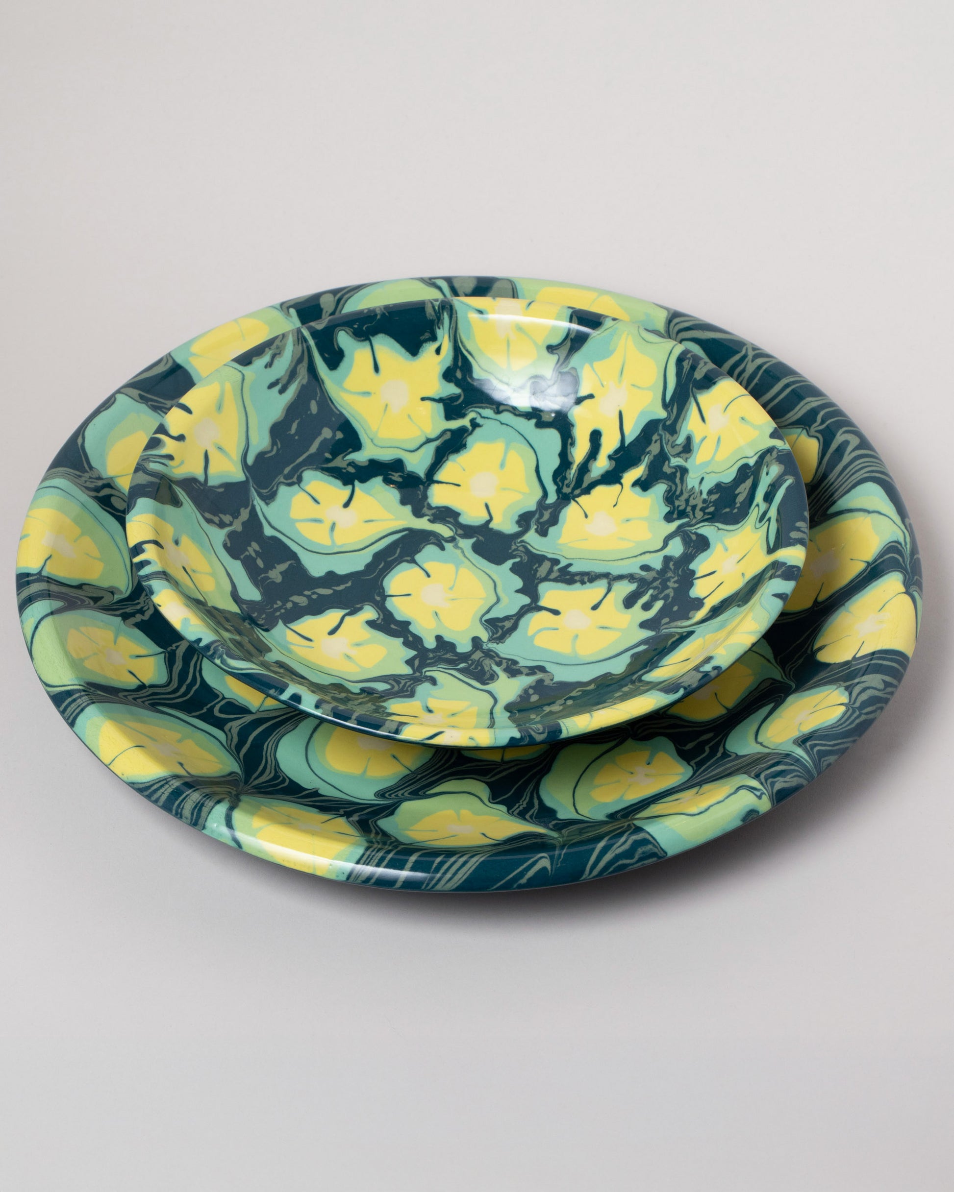 Closeup details of the Morgan Levine Clover Pasta Bowl and Morgan Levine Clover Platter on light color background.