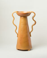 Morgan Peck Tall For Your Pleasure Daffodil Vase on light color background.