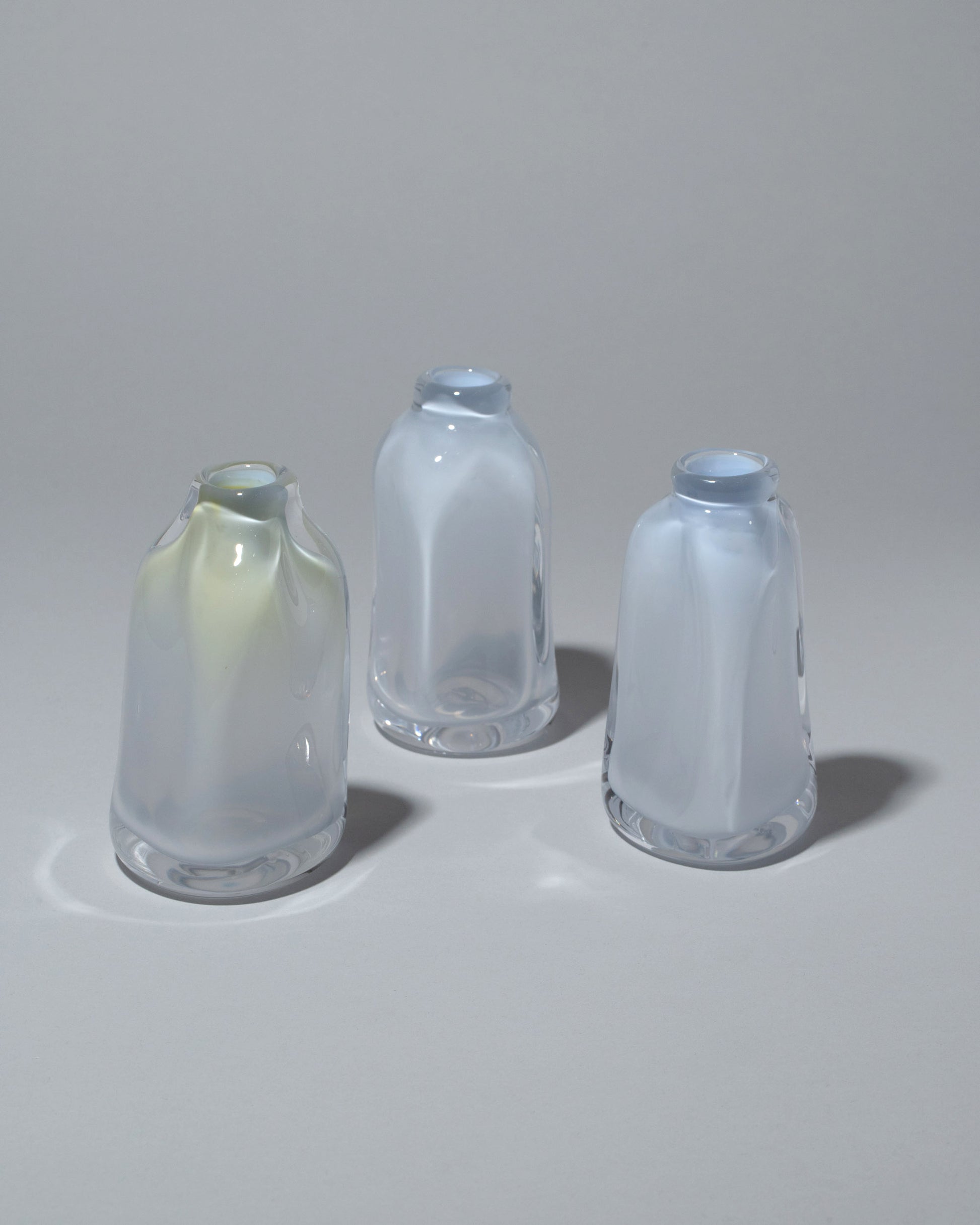 Group of BaleFire Glass Small Cloud Suspension Vases on light color background.