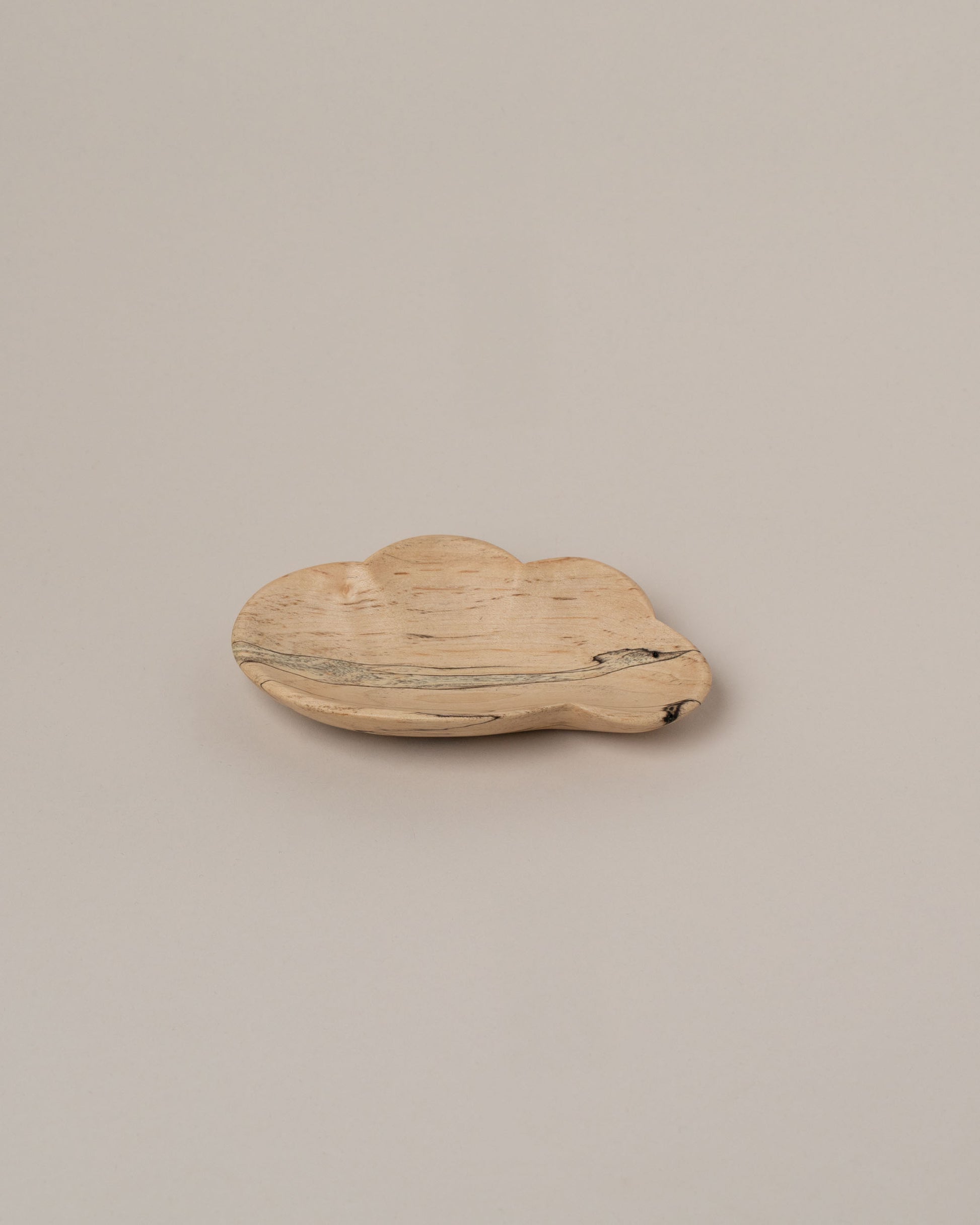 Namu Home Goods One Cloud Plate on light color background.