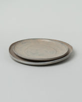 Namu Home Goods Large Zelkova Wood Winter Organic Plate and Namu Home Goods Small Zelkova Wood Winter Organic Plate on light color background.
