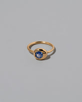 Blue Sapphire Level Ring on light color background.