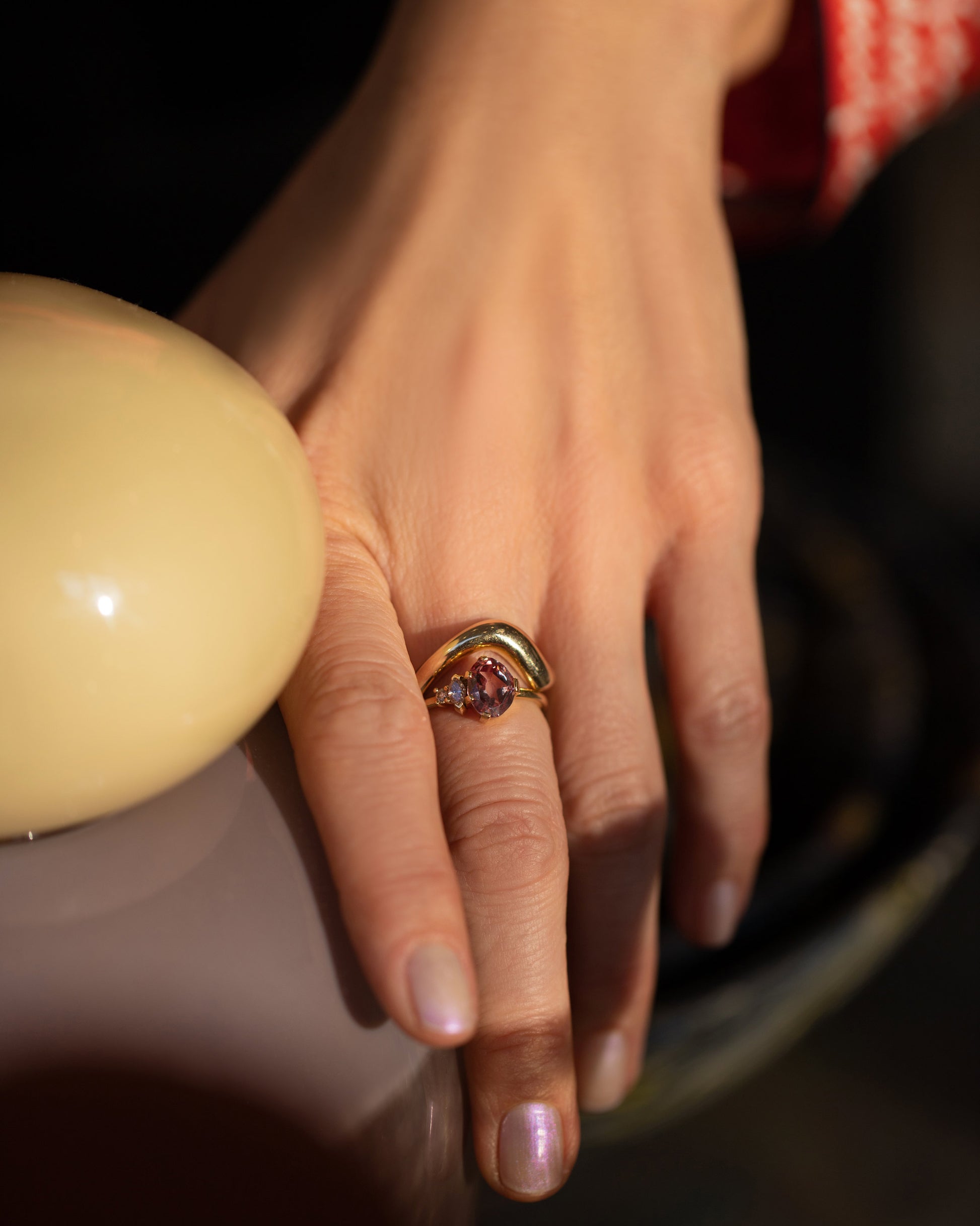 Gold Unbroken Band and Wren Ring on model.