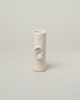 Bonam Kim White Ear Pillar Vase on light color background.