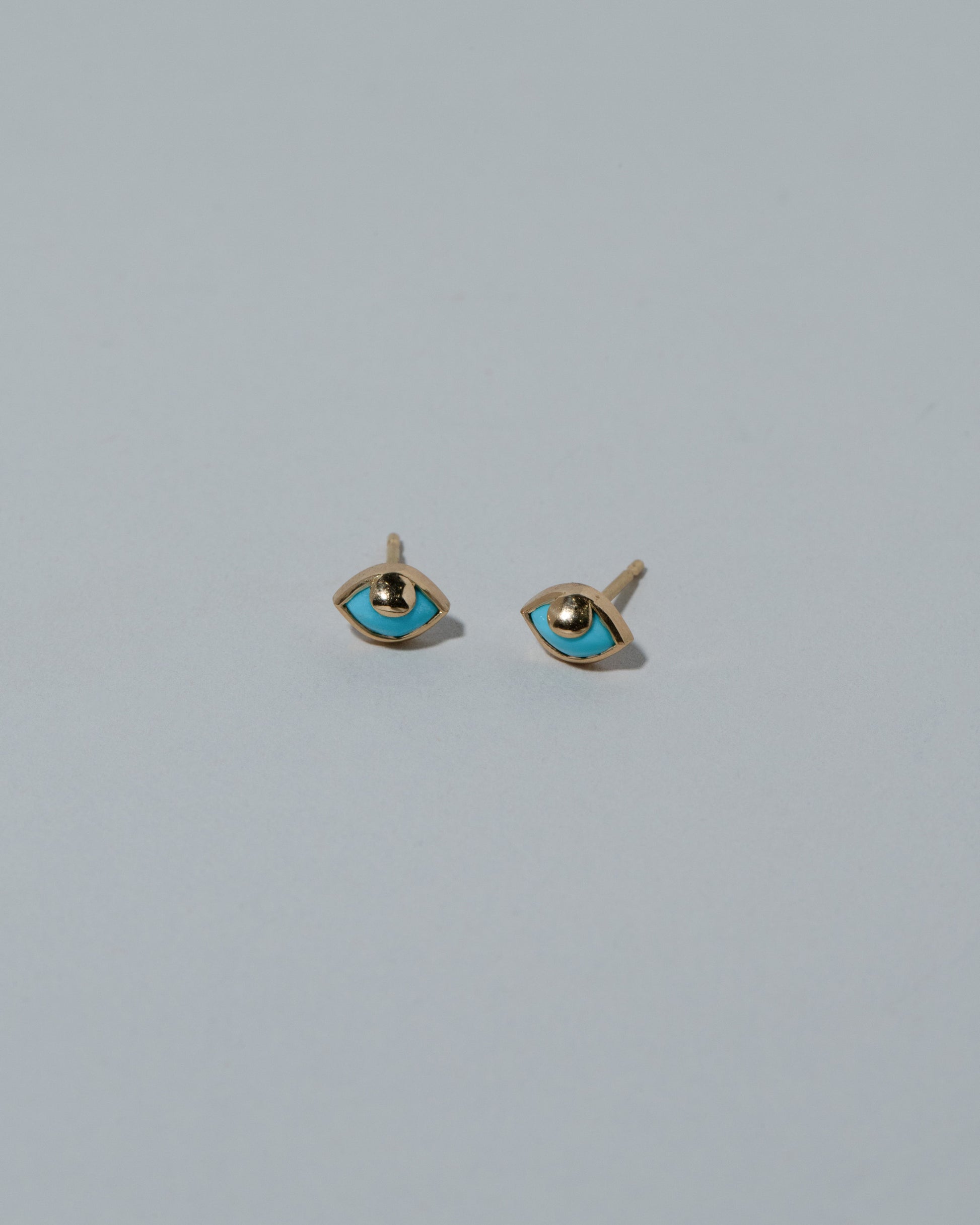 Samples & Imperfects Eye See You Stud Earrings on light color background.