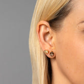 product_details::Envelop Earrings on model.