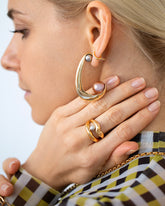 Channeling Hoop Earrings and Midnight Pearl Ocean of Unity Ring on model.