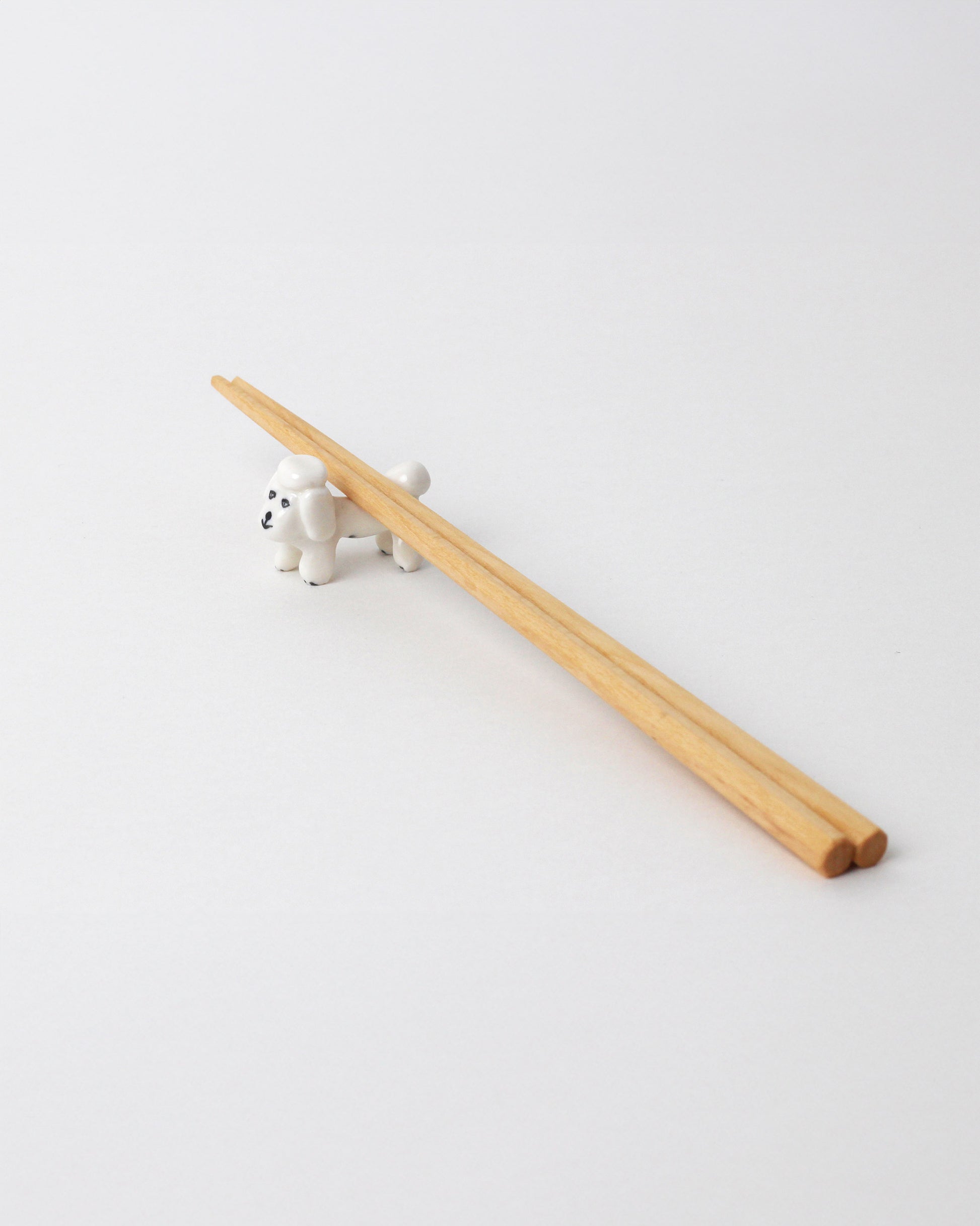 Eleonor Boström Bichon Frise PARK Chopstick Dog Rest on light color background. Chopsticks not included.