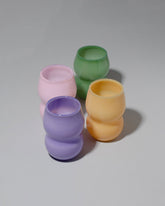 product_hover::Group of Ornamental by Lameice Mint, Violet, Topaz and Pink Opaque Dreamlike Cups on light color background.