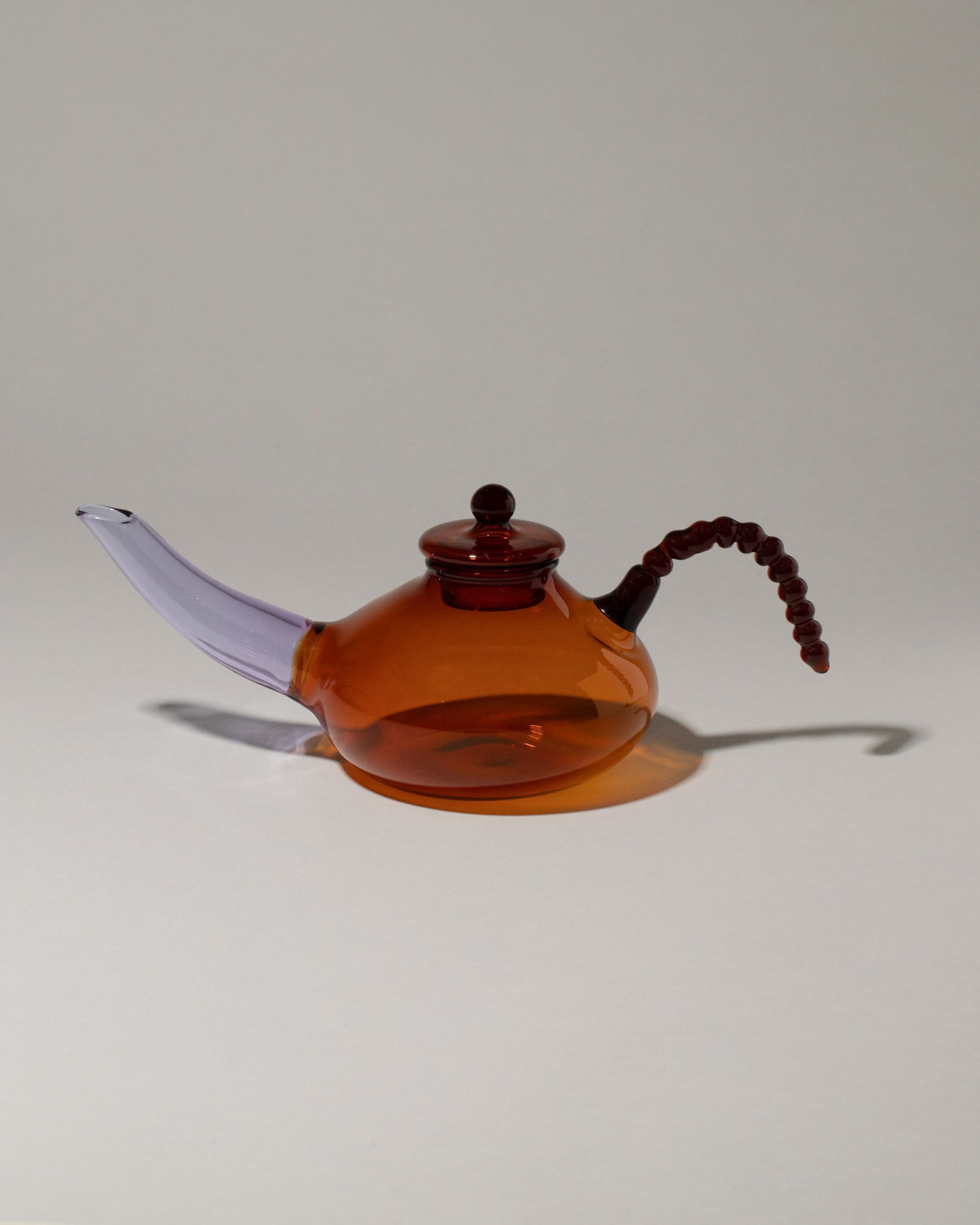 Ornamental by Lameice Amber & Lilac Dreamlike Teapot on light color background.