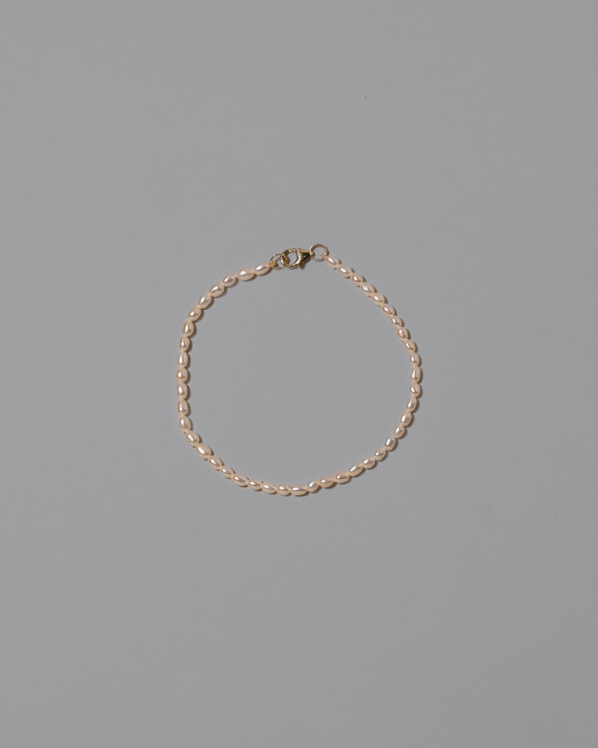 White Oval Pearl Bracelet on light color background.