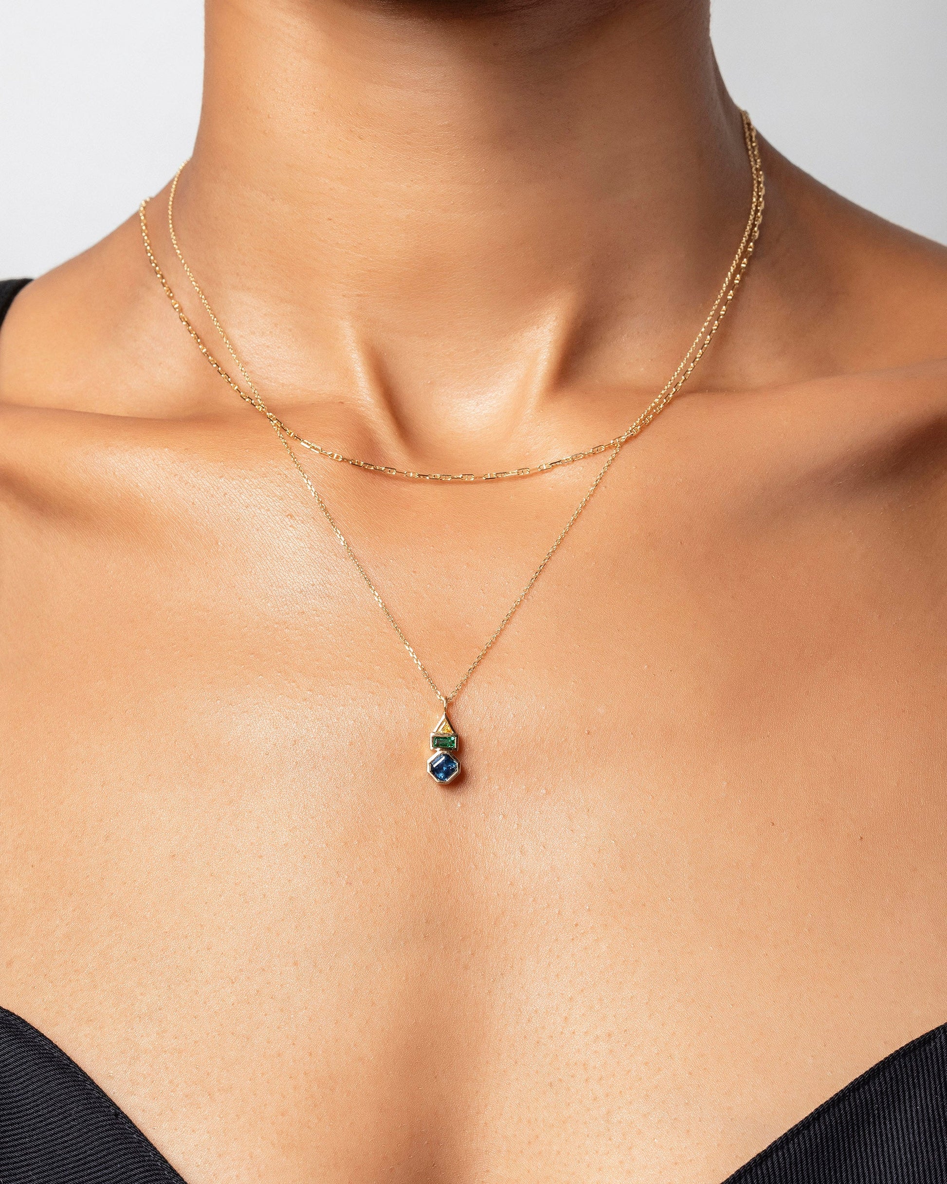Positive Energy Necklace and Petite Diamond Cut Chain Necklace on model.