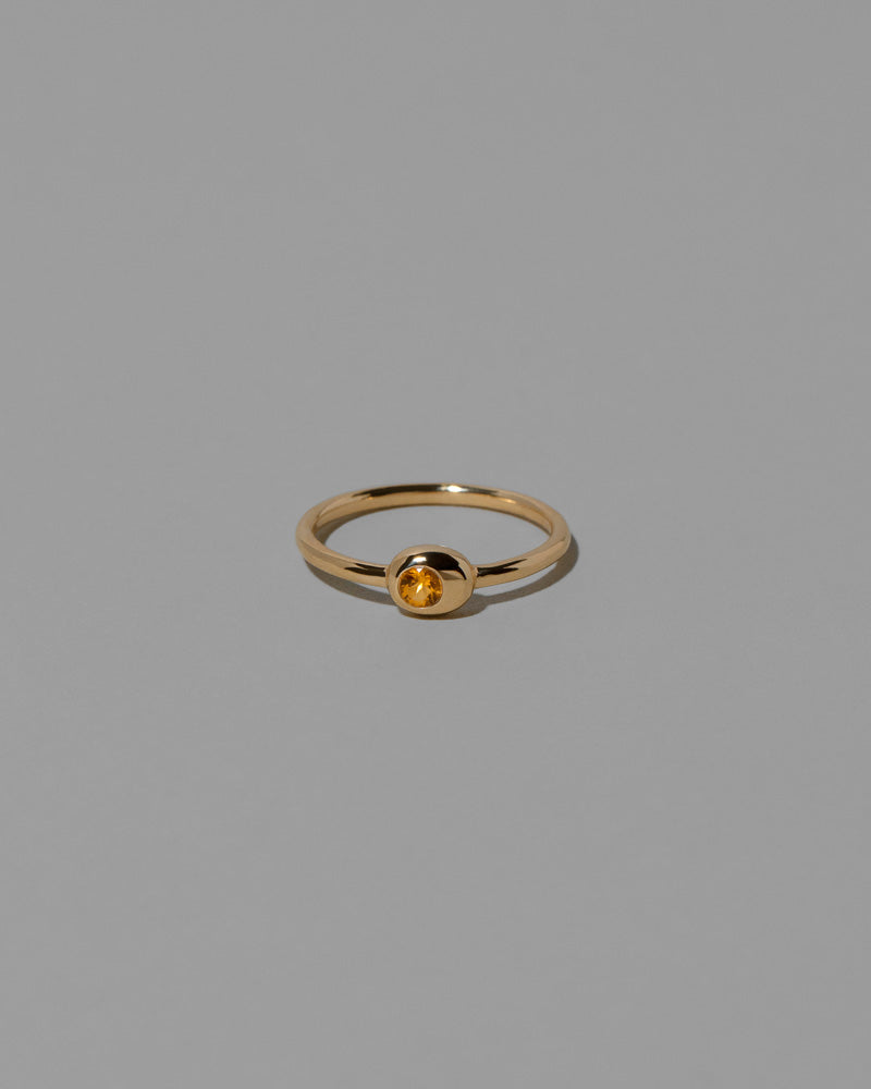 Citrine Birthstone Level Ring on light color background.