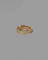 Gold Diamond North South 6mm Baguette-Set Piet Band on light color background.