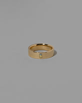 Gold Montana Bicolor Sapphire North South 6mm Baguette-Set Piet Band on light color background.