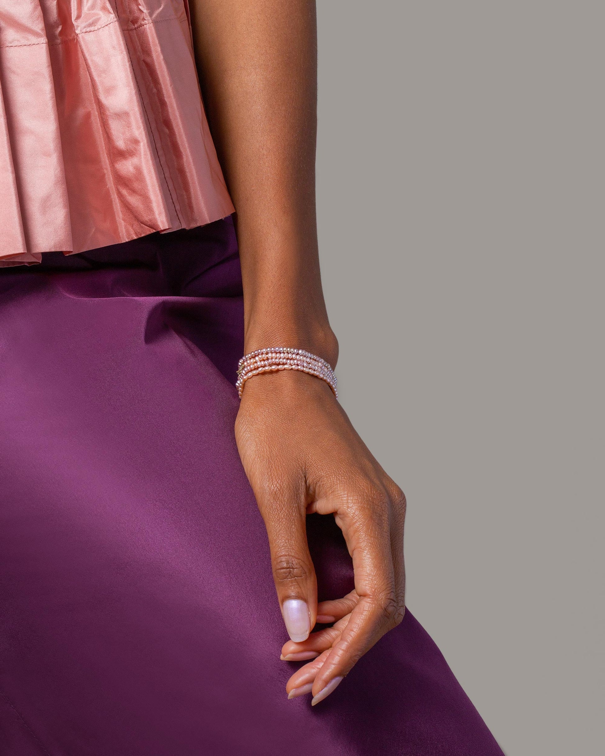 Pink Peony Seed Pearl Bracelets and Pink Peony Oval Pearl Bracelet on model.