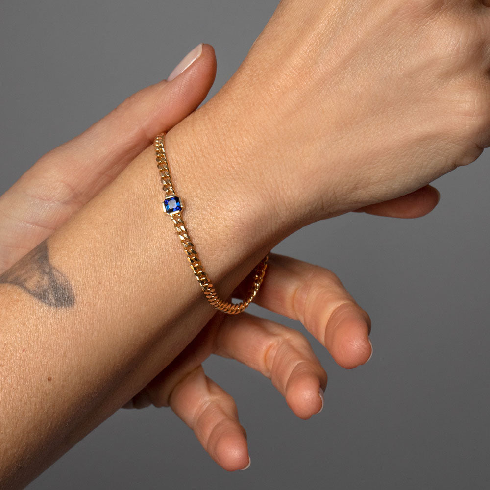 product_details::Blue Sapphire Fold Bracelet on model.