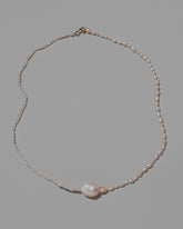 Pontus Pearl Necklace on light color background.