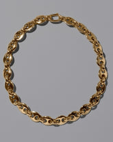 CRZM Gold Bedrock Bracelet on light color background.