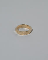 Gold 5mm Segmented Half Hoop Band on light color background.