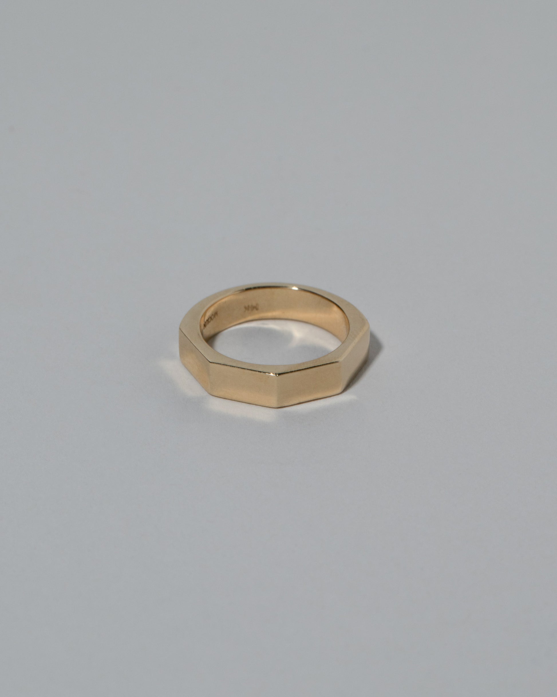 Gold 5mm Segmented Half Hoop Band on light color background.