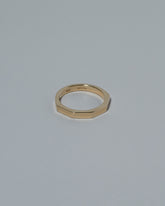 Samples & Imperfects 3mm 14k Yellow Gold Segmented Half Hoop Band on light color background.