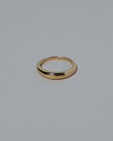 Samples & Imperfects 5mm 18k Yellow Gold Venus Band on light color background.