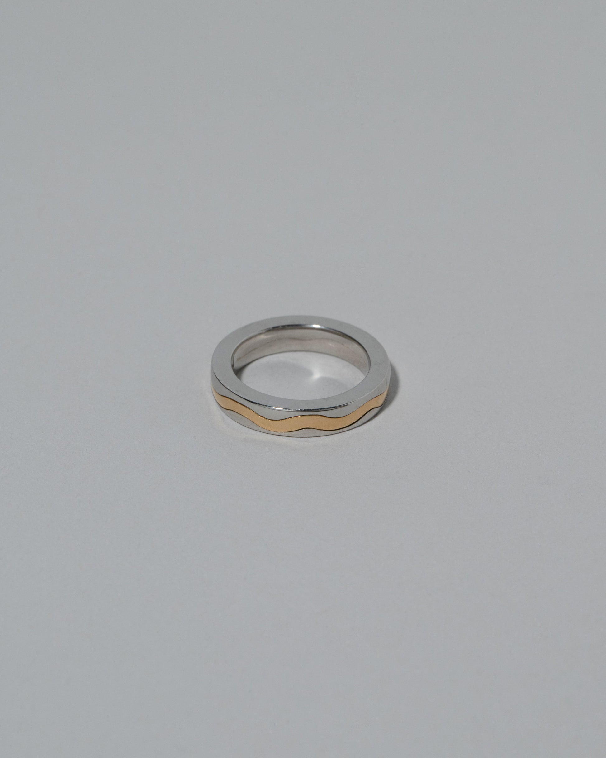 Samples & Imperfects 4mm Yellow Gold & Platinum Inlaid Band on light color background.