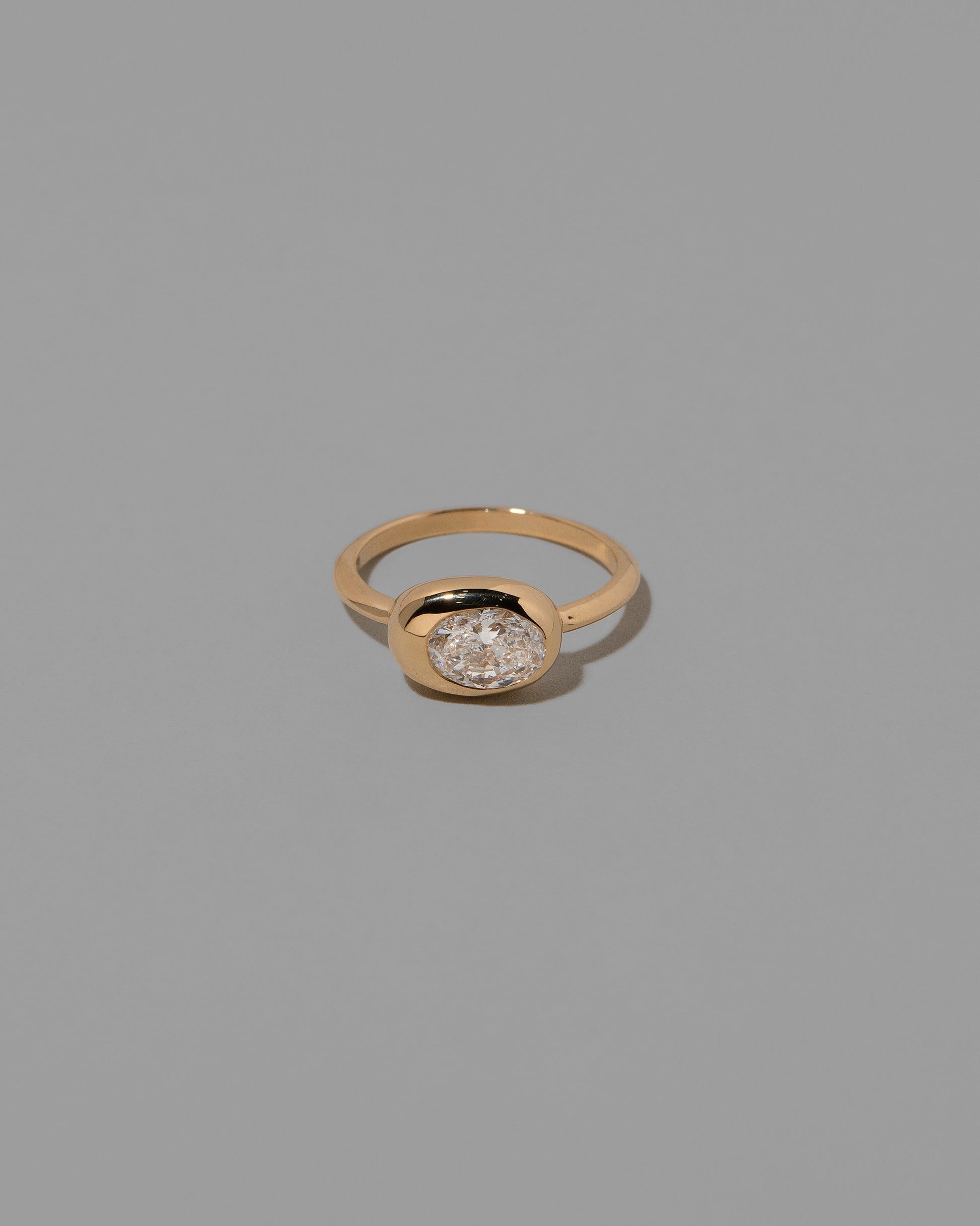 Oval Diamond Equalize Ring on light color background.