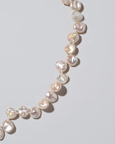 Tern Pearl Necklace on light color background.