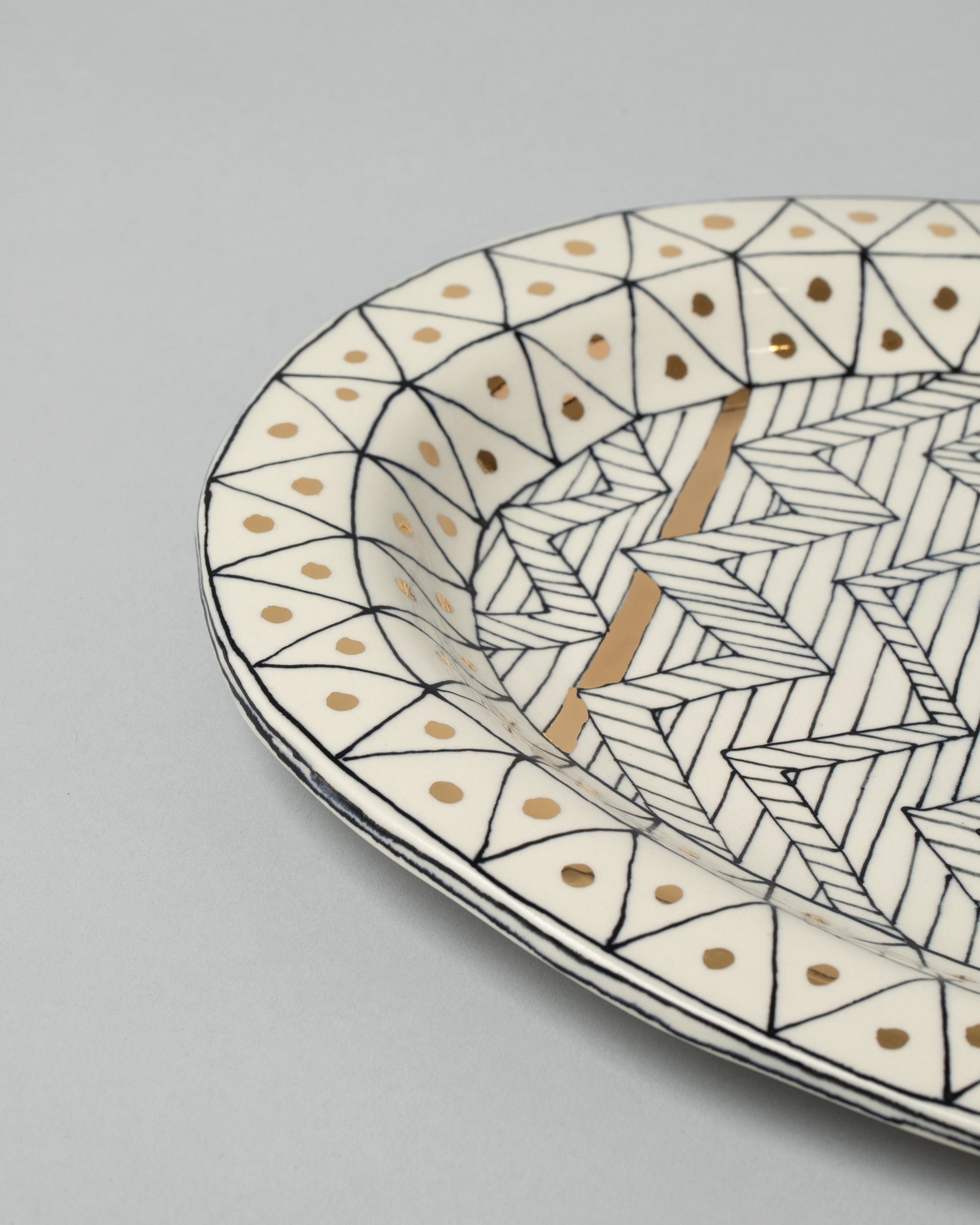 Closeup detail of the Suzanne Sullivan Oval Platter on light color background.