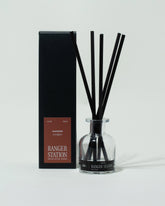 Ranger Station Oakmoss Reed Diffuser and packaging on light color background.