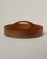 Rikke Falkow Cherry Wood Two-Sided Carrier on light color background.