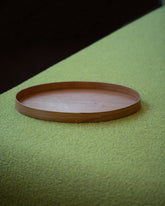 Rikke Falkow Small Cherry Wood Serving Tray on light color background.