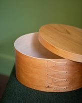 Styled image featuring the Rikke Falkow 13" Cherry Wood Oval Box.