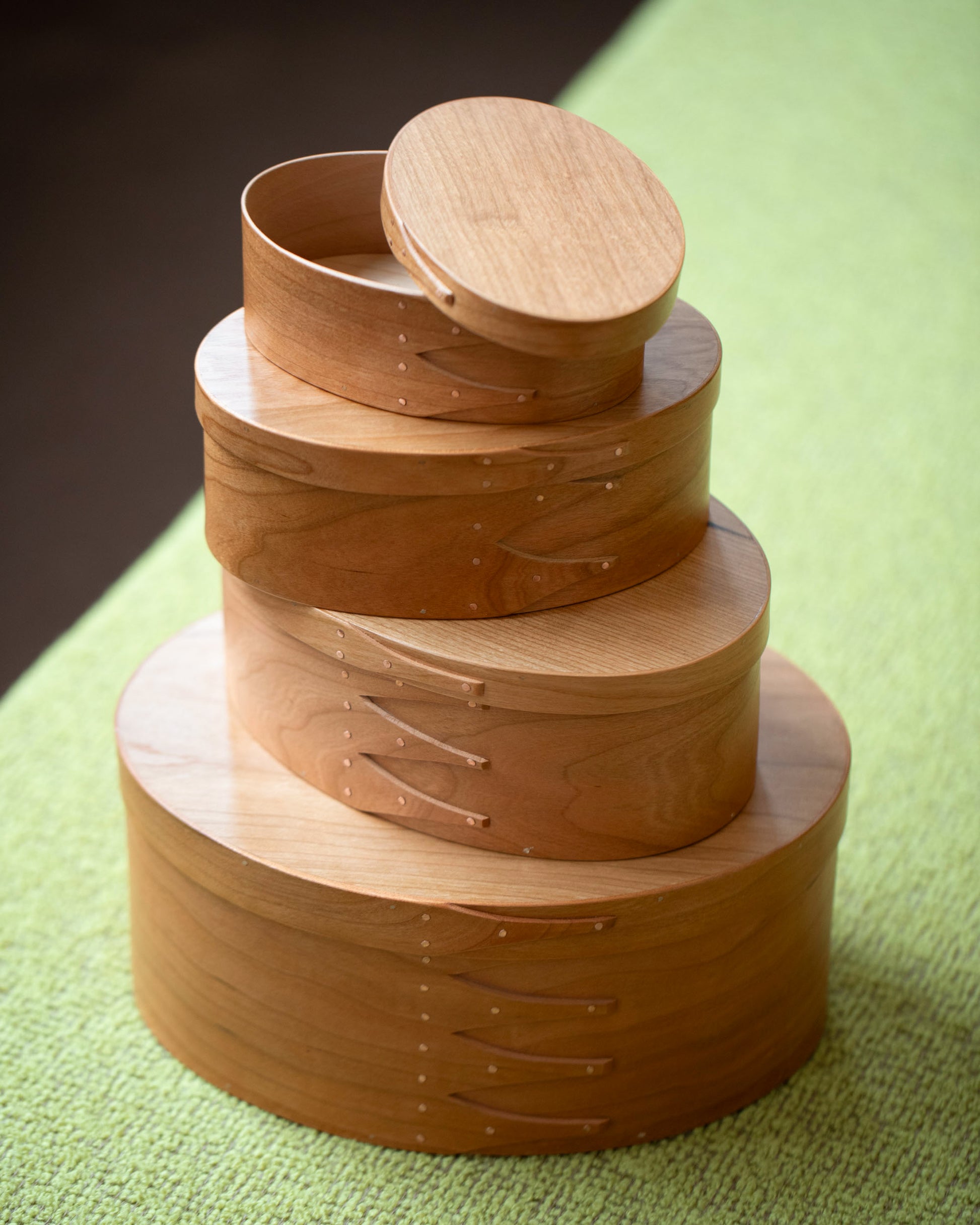 Styled image featuring the Rikke Falkow 13" Cherry Wood Oval Box.